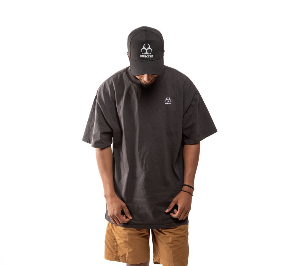 Model wearing the TD Core Oversized Tee in black, front view