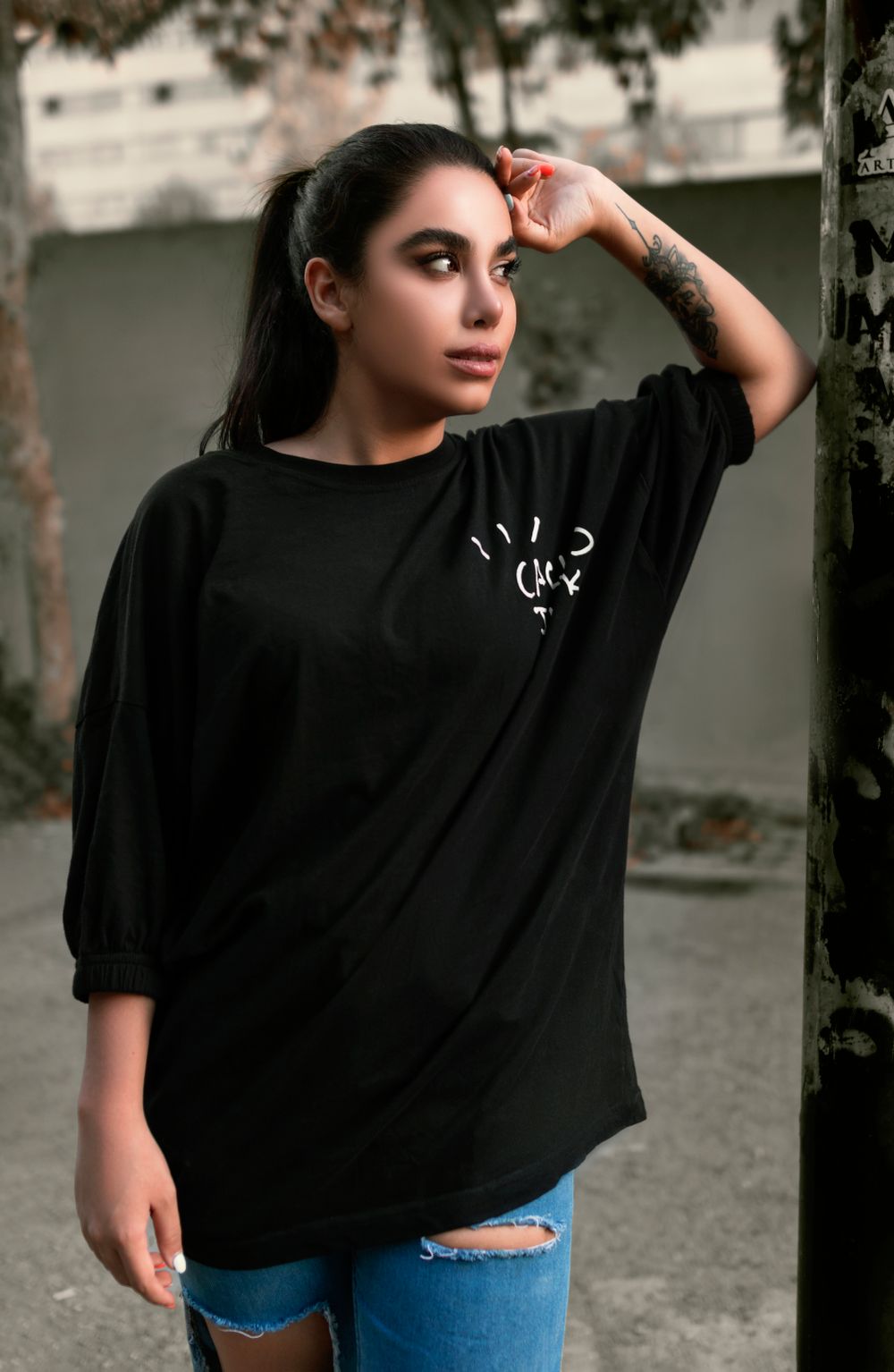 Model wearing the TD Signal Graphic Tee in black