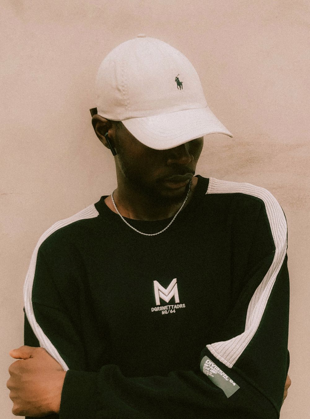 Model wearing the TD Six-Panel Cap in stone